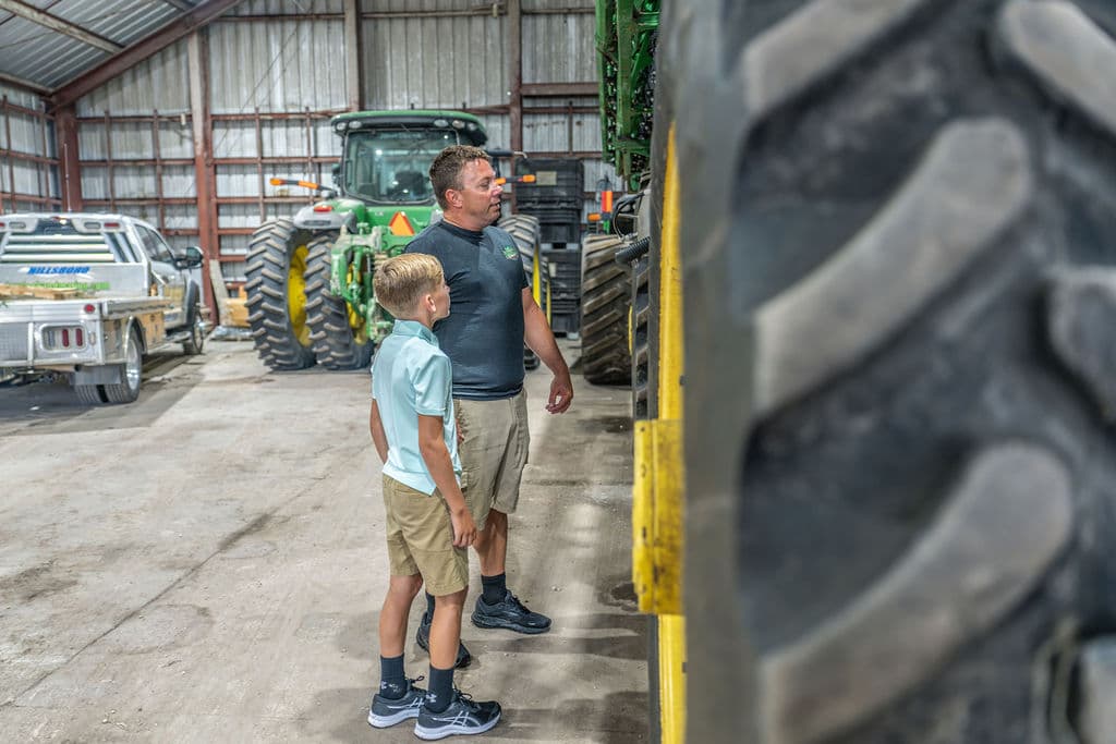 Father and son in the machine shed